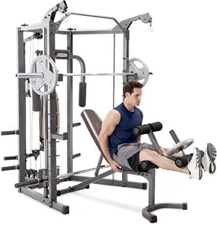 man using a smith machine at the gym