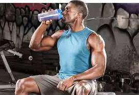 Man drinking his pre workout supplement