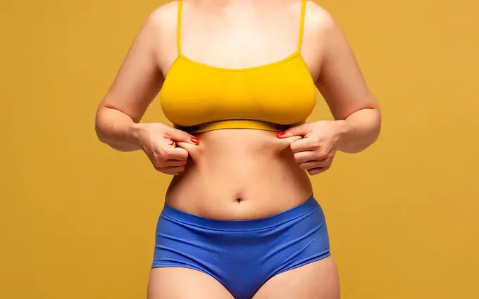 woman holding her fat